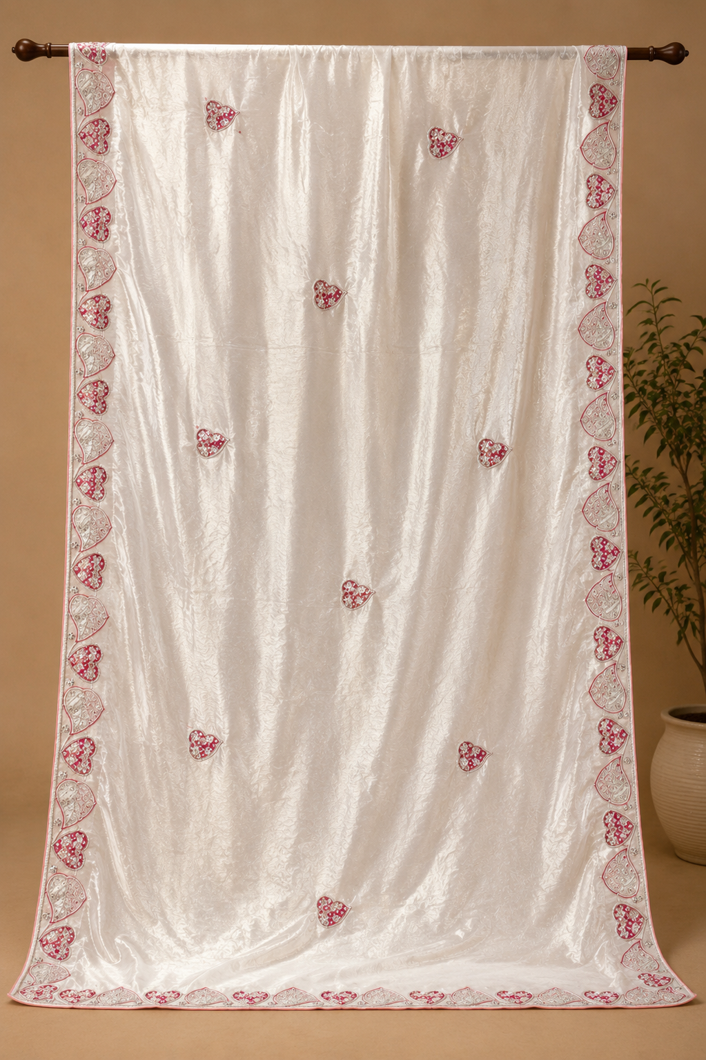 Ivory Pearl Crepe Silk Saree with Red & Silver Embroidered Heart Motifs