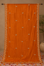 Burnt Orange Synthetic Chiffon Saree with Golden Leaf Embroidery & Floral Vine Border